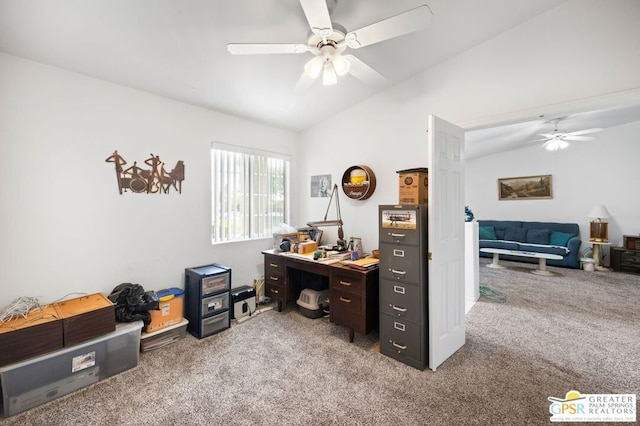 carpeted office space with vaulted ceiling and ceiling fan