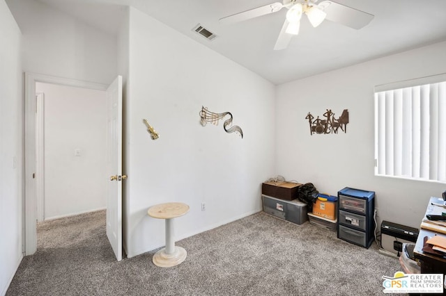 misc room with ceiling fan and carpet