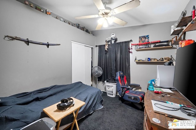 carpeted bedroom with ceiling fan and a closet