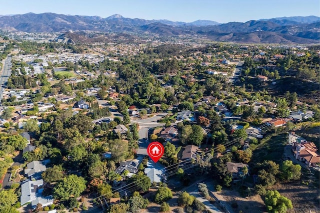 birds eye view of property with a mountain view