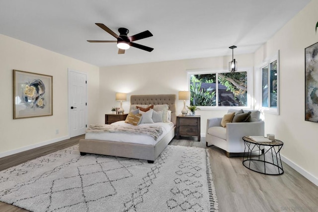 bedroom featuring ceiling fan and hardwood / wood-style floors