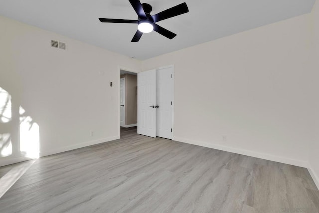 unfurnished bedroom with ceiling fan and light hardwood / wood-style floors