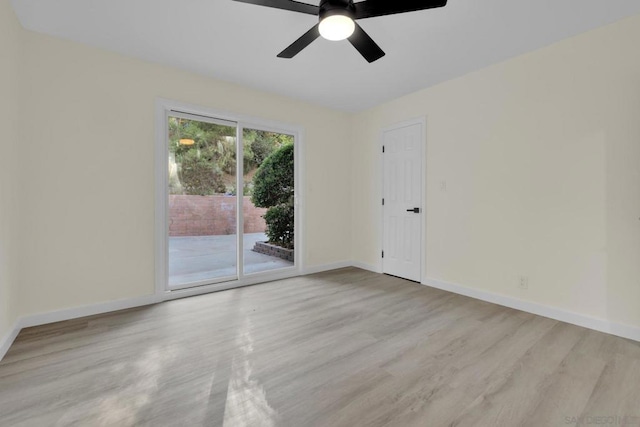 empty room with ceiling fan and light hardwood / wood-style floors