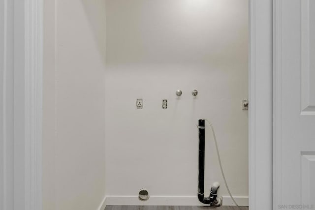 washroom featuring washer hookup, wood-type flooring, and electric dryer hookup