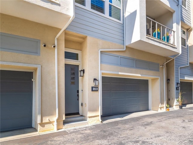 doorway to property featuring a garage