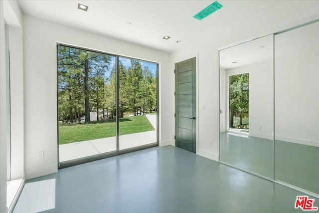 doorway to outside featuring concrete flooring