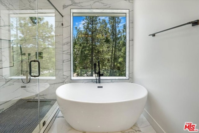 bathroom with separate shower and tub