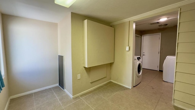 washroom featuring ornamental molding and washer / clothes dryer