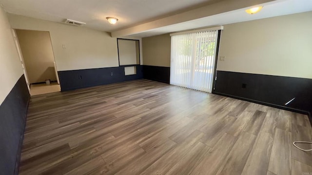 spare room featuring hardwood / wood-style floors