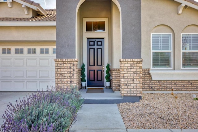 doorway to property featuring a garage