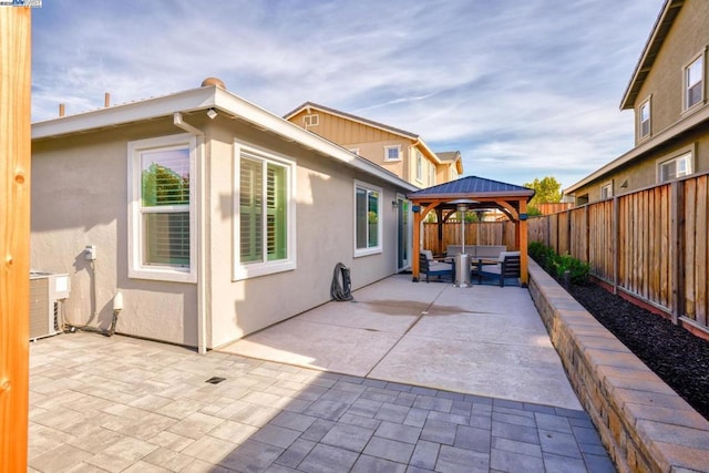 exterior space featuring an outdoor hangout area and a gazebo