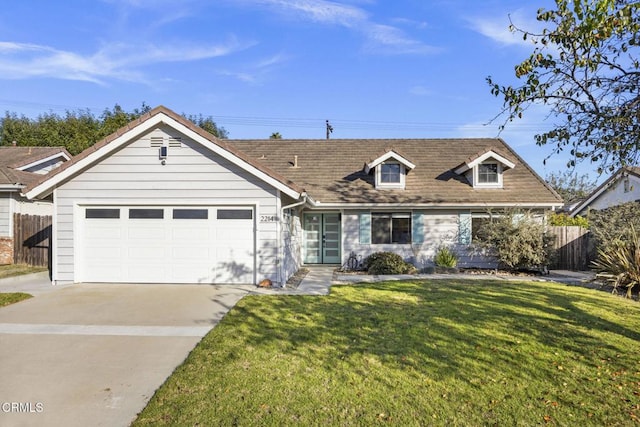 view of front facade with a front lawn and a garage