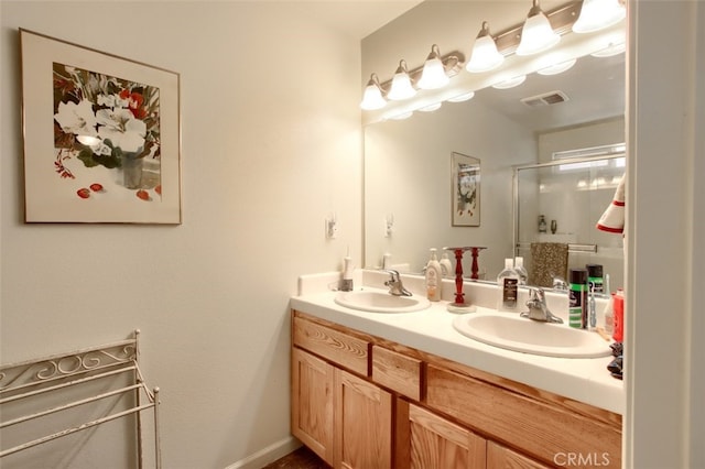 bathroom featuring an enclosed shower and vanity