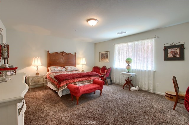 bedroom with dark carpet