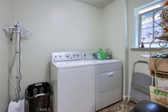 laundry area featuring washing machine and clothes dryer