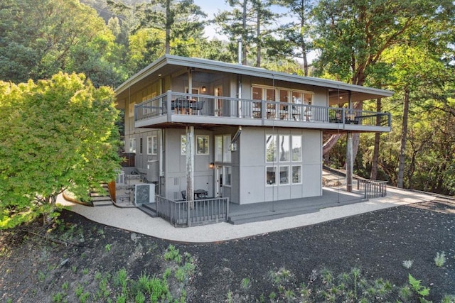 exterior space with a patio area and a balcony