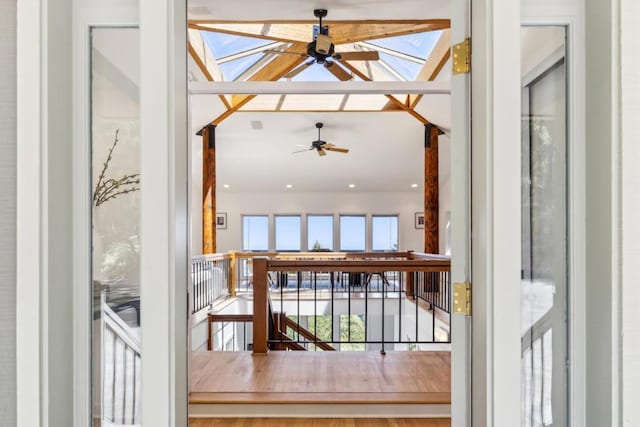 doorway to outside with ceiling fan and a healthy amount of sunlight