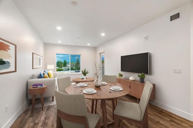 dining area with wood-type flooring