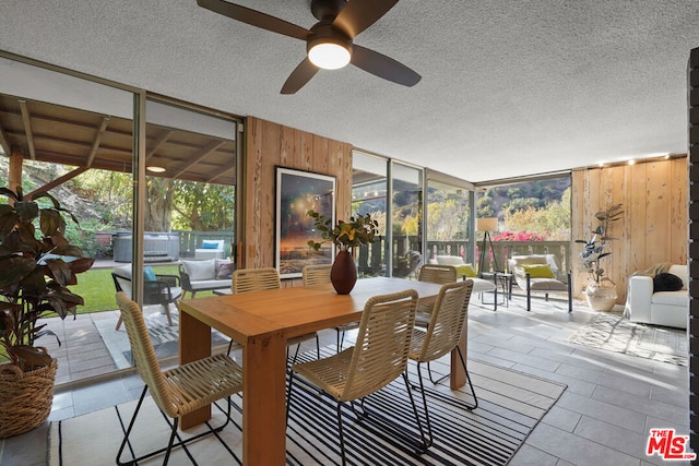 sunroom / solarium with ceiling fan