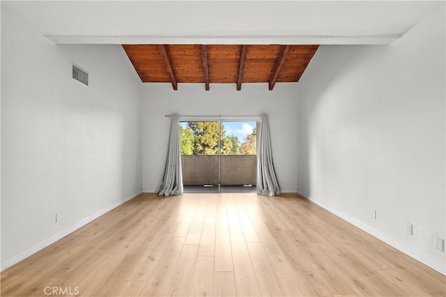 empty room featuring light wood-type flooring, lofted ceiling with beams, and wood ceiling