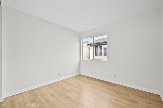 unfurnished room featuring light wood-type flooring