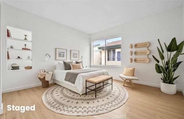 bedroom with hardwood / wood-style flooring