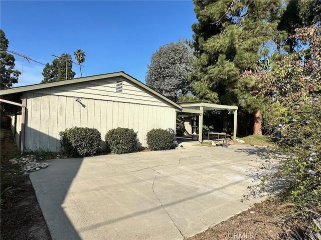 view of side of home featuring a patio area