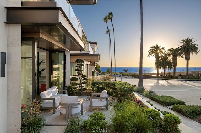 patio terrace at dusk with a water view