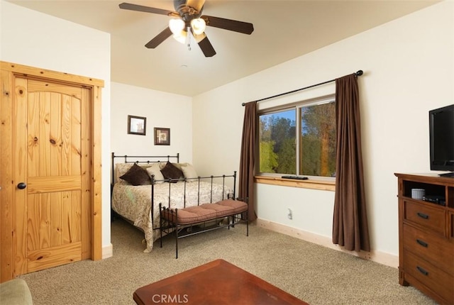 bedroom with carpet floors, a ceiling fan, and baseboards