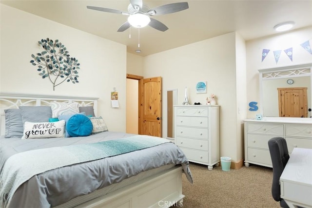 bedroom with a ceiling fan and light colored carpet