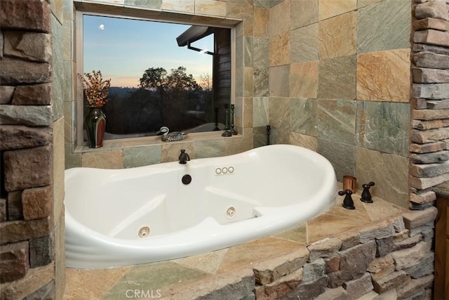 bathroom featuring a whirlpool tub