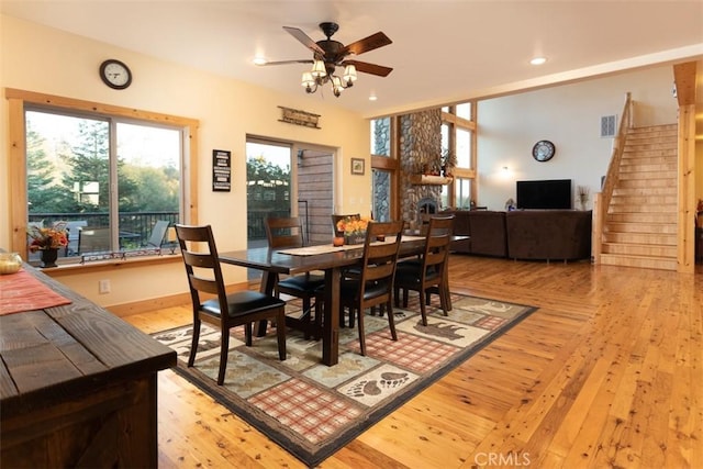 dining area featuring visible vents, light wood-style flooring, ceiling fan, stairway, and recessed lighting