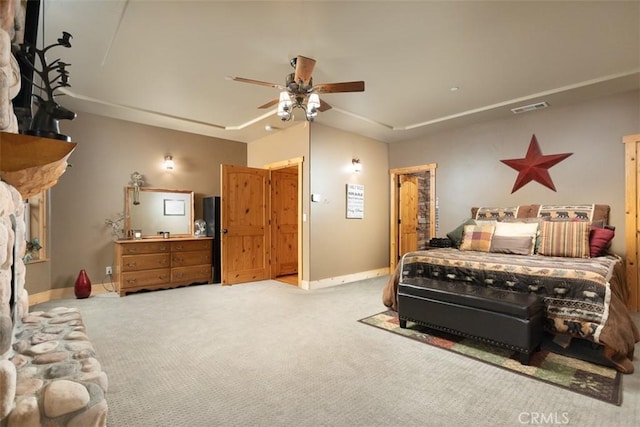 bedroom with baseboards, ceiling fan, visible vents, and light colored carpet