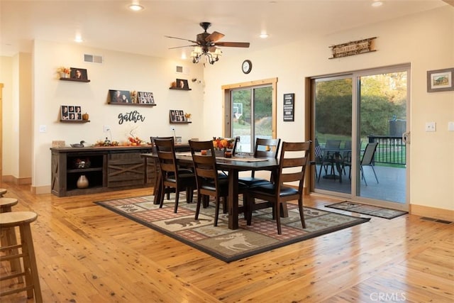 dining space featuring recessed lighting, visible vents, and light wood-style floors