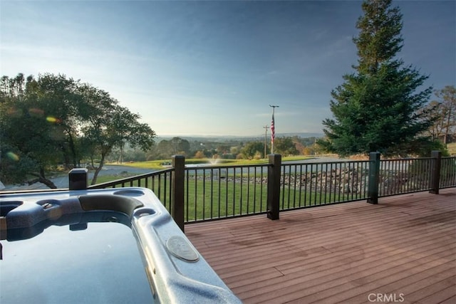 wooden deck with a lawn