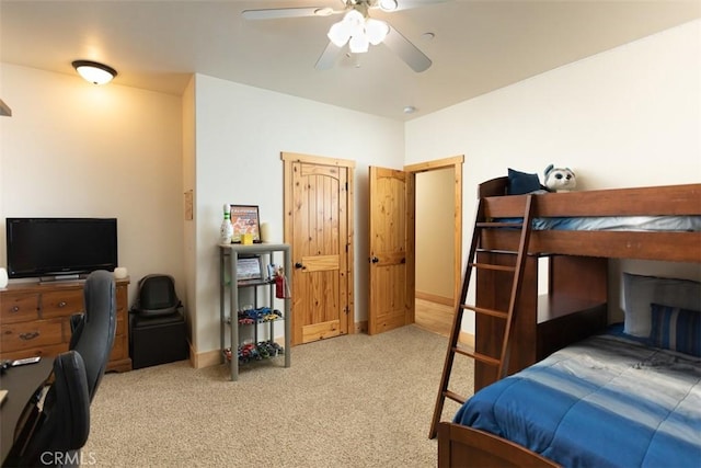 bedroom featuring ceiling fan, baseboards, and light colored carpet