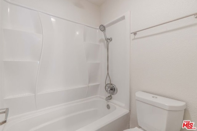 bathroom featuring toilet and bathing tub / shower combination