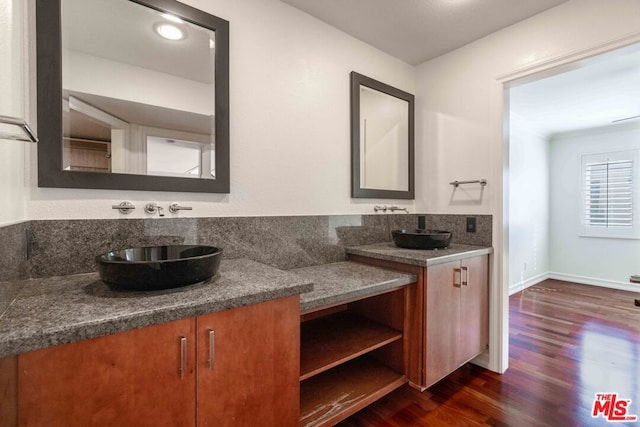 bathroom with wood-type flooring and vanity