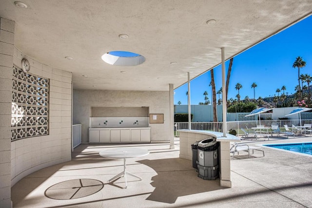 view of patio / terrace featuring a fenced in pool