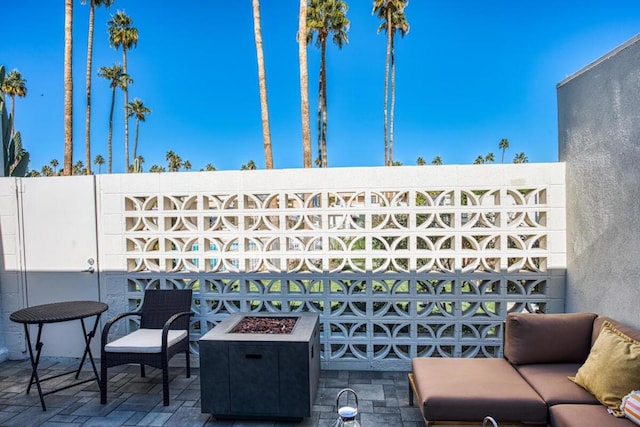 view of patio featuring a fire pit