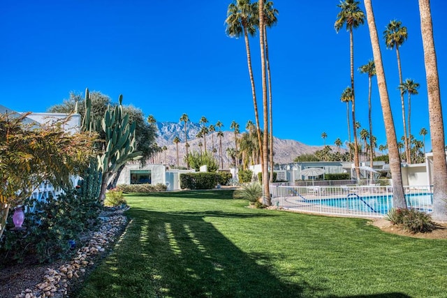 view of yard with a community pool