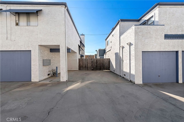 view of side of home with a garage