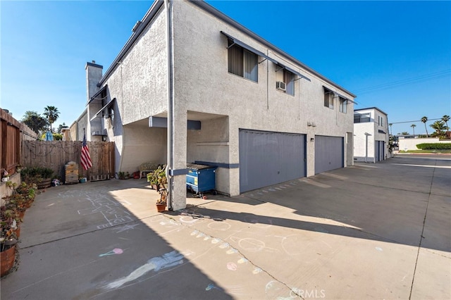 back of property featuring a garage