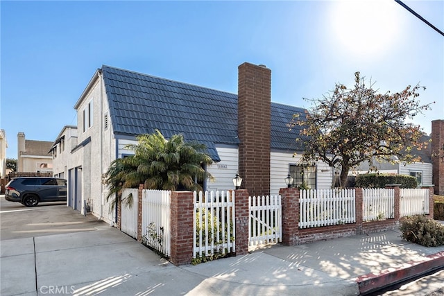 view of side of home featuring a garage