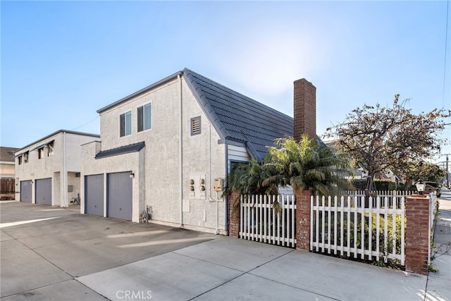 view of side of property with a garage