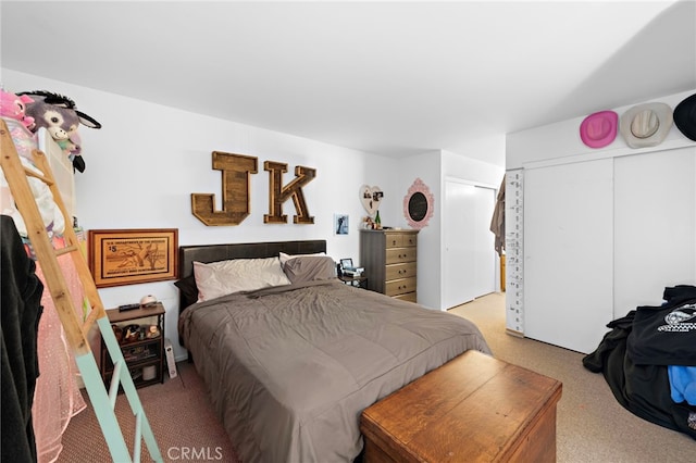 carpeted bedroom featuring a closet