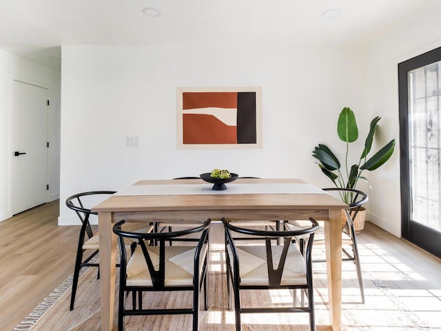 dining space with light wood-type flooring