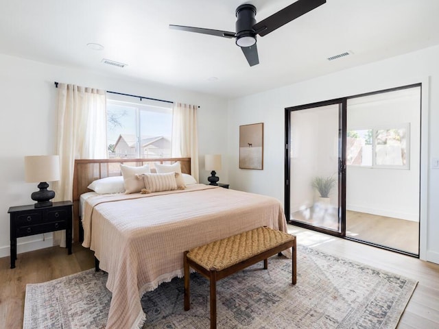 bedroom with ceiling fan, access to exterior, and light wood-type flooring