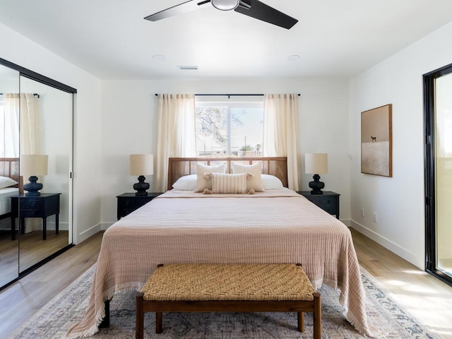 bedroom with ceiling fan, a closet, and light wood-type flooring