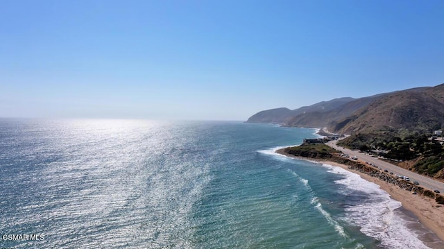 property view of water featuring a mountain view and a view of the beach